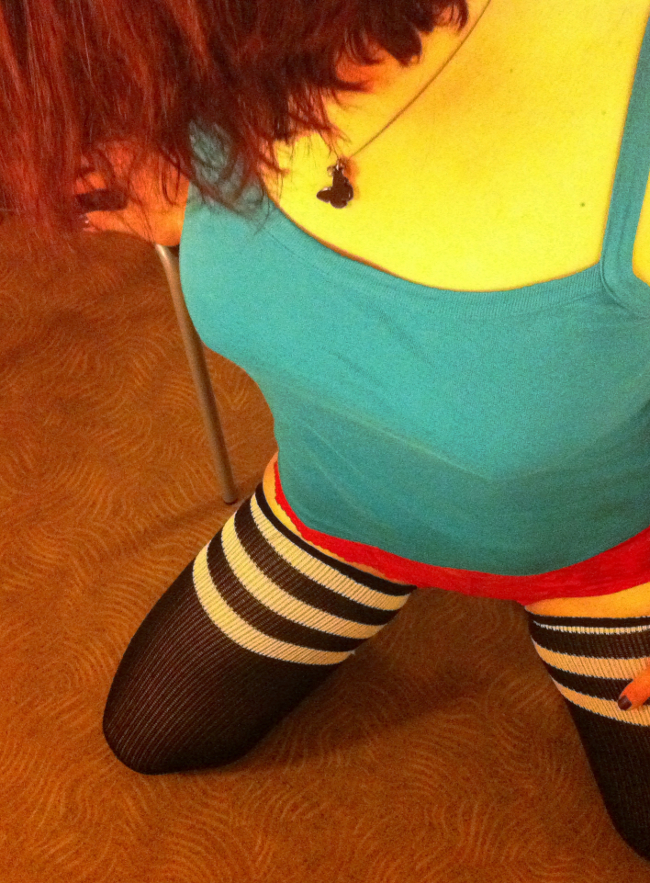 Girl on her knees blue top red knickers