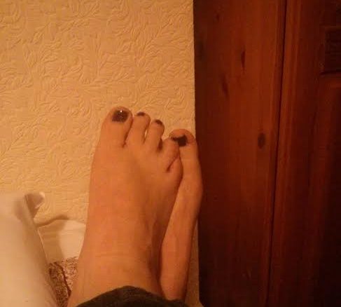 here is a picture of my feet that I sent to a man on the internet. Please do not judge me by the decor - it is not my flat