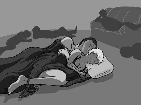 two people snuggled under a blanket in a dark room with other people in it