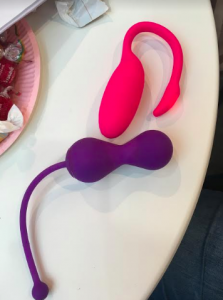 Picture of smart sex toys with purple kegel balls and pink curvy thing that sits inside your vagina