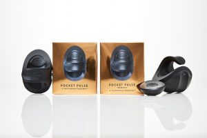 Picture of small, black Pocket PULSE sex toys next to gold boxes, one of the black toys has a circular remote sitting next to it