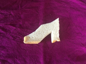 Picture of a slice of bread cut into the shape of a high heel shoe