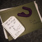 Mysteryvibe crescendo smart sex toy sitting on a folder labelled dick research'