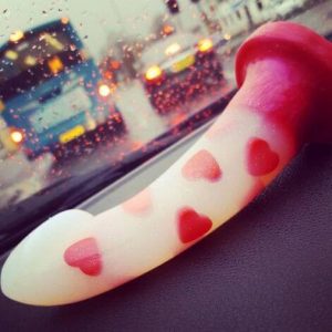 Dildo with hearts embedded in it