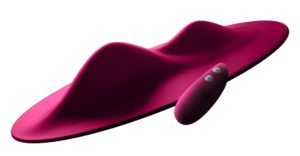 Pink sex toy in the shape of a pad with ridges that you can sit on