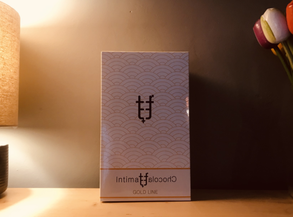 Image of a white box with symbols on the front and the words 'intimate chocolate'