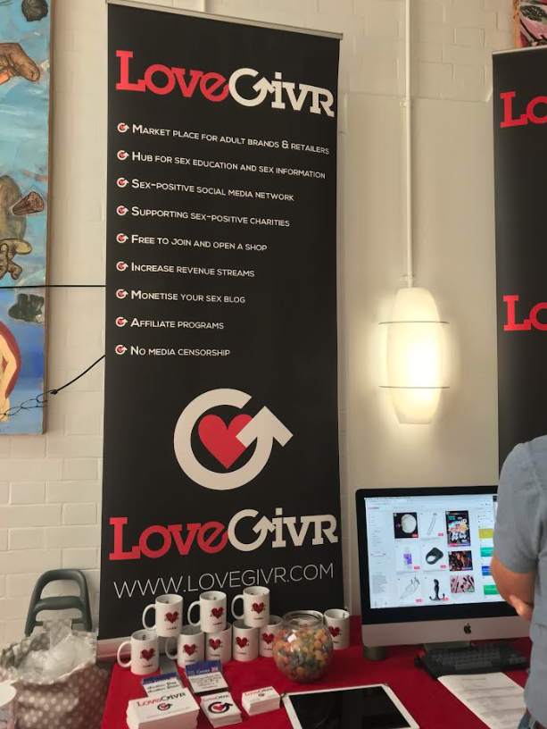 Image of LoveGivr stand with banner advertising what their site is all about lovegivr.com for more info