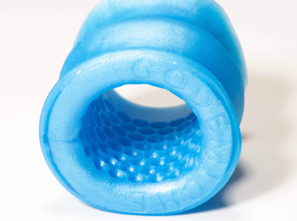 Blue masturbation sheath with an inner texture consisting of lots of tiny indents, like the suckers on an octopus tentacle