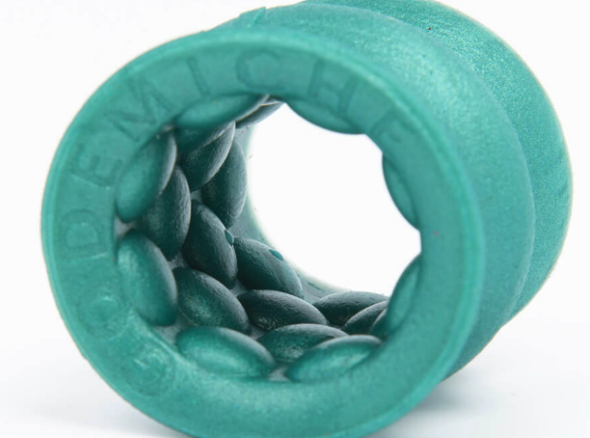 Inside of green masturbation sheath showing an interior texture that consists of large bubbles