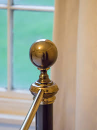 Picture of a gold brass bedknob, smooth and temptingly fuckable