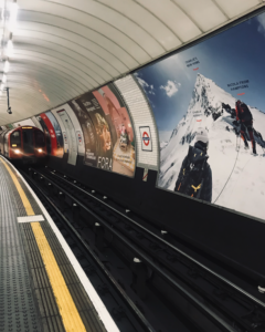 Shot of a central line tube train pulling in to the platform