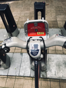 Shot of the handlebars of a Santander bike in a docking station