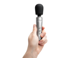 Dinky silver-bodied, black-headed wand toy roughly 4-5 inches in height, held aloft in someone's hand